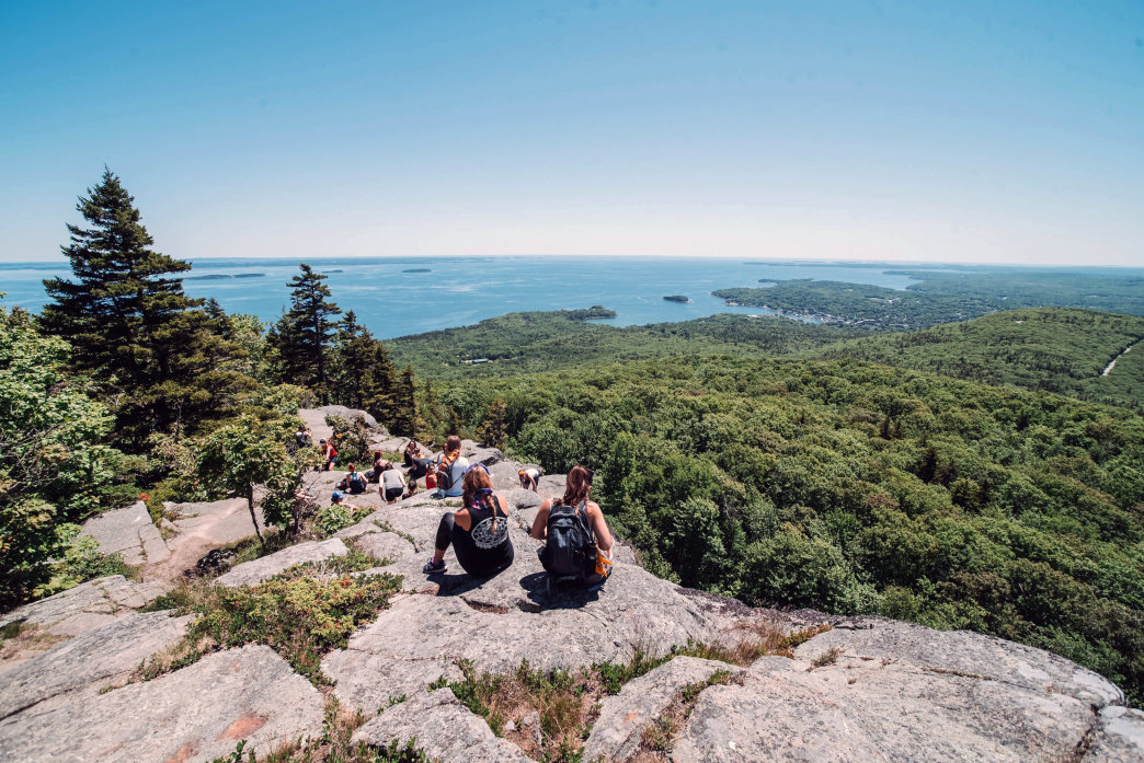 Hikers break to on the way to the top of Mt. Meginticook. Every peak in Camden has a water view.