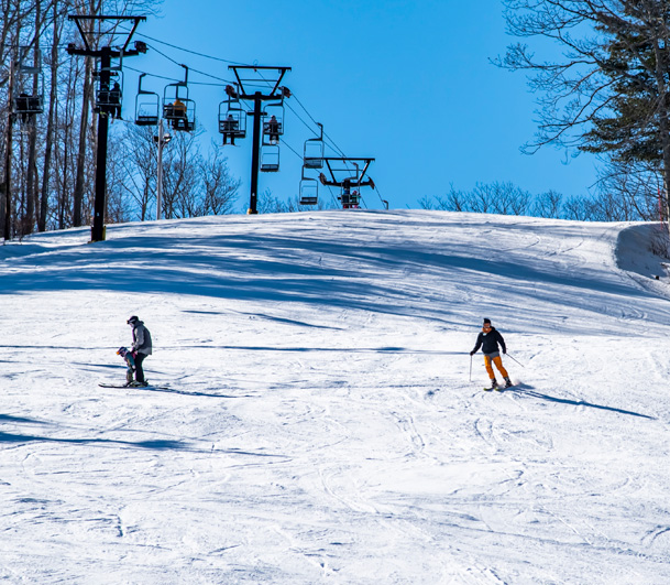 Skiers on the slopes at the Camden Snow Bowl