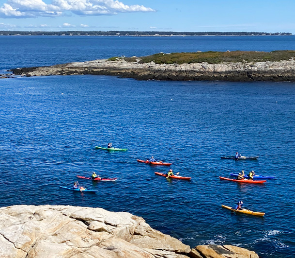 Kayaking off the rocky shore of Reid State Park in Georgetown, Maine