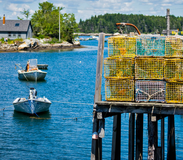 Lobster traps on a dock in Phippsburg, Maine. Free MidCoast Guidebook