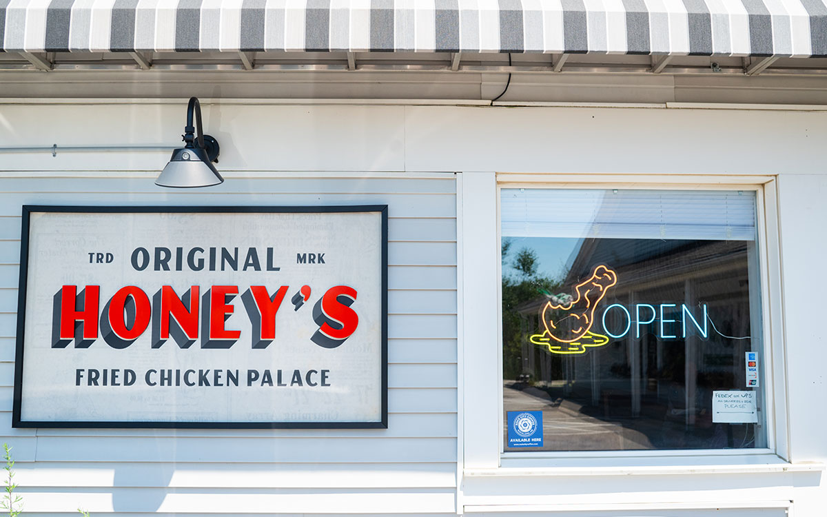 Exterior sign for "Original Honey's Fried Chicken Palace" and neon "open" sign, Thomaston, Maine