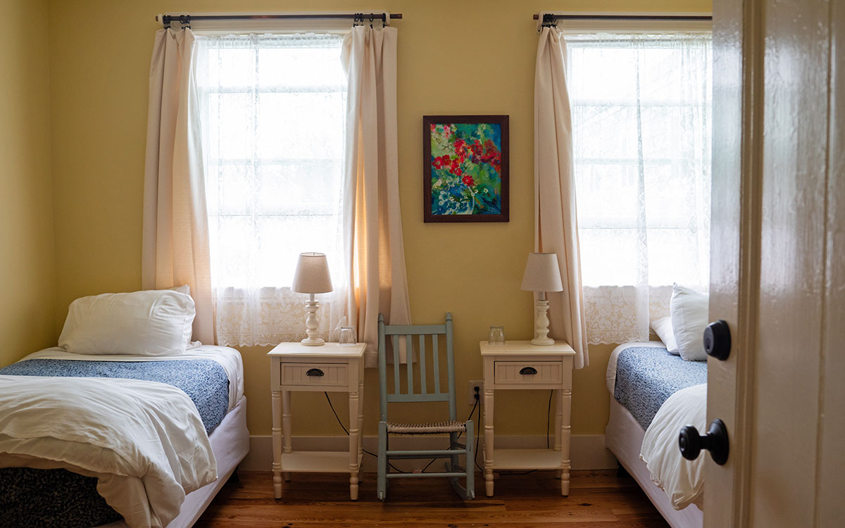 Bedroom with two twin beds at the Monhegan House, Monhegan Island, Maine